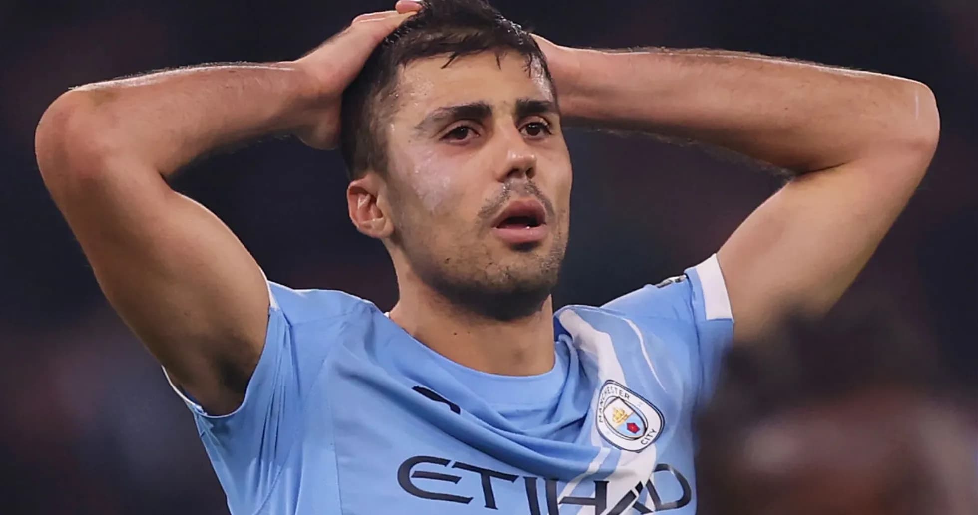 Player holding head in disappointment during match