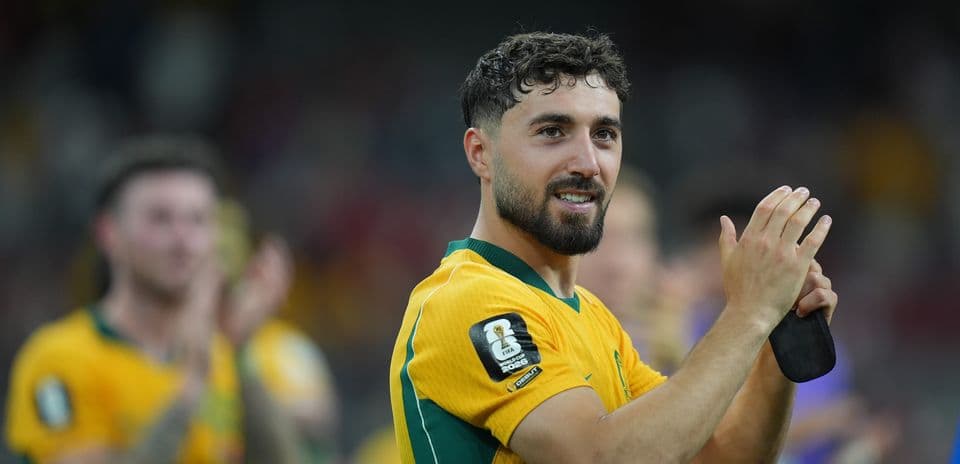 Player applauding fans after a match