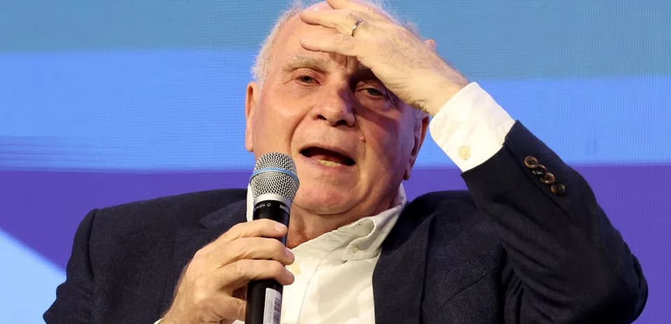 Speaker holding microphone during discussion event