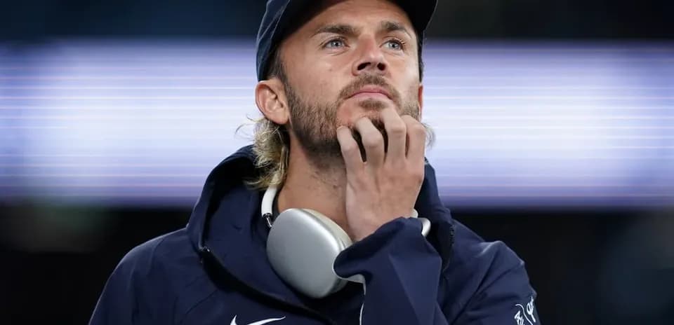 Man in sportswear looking thoughtfully during event