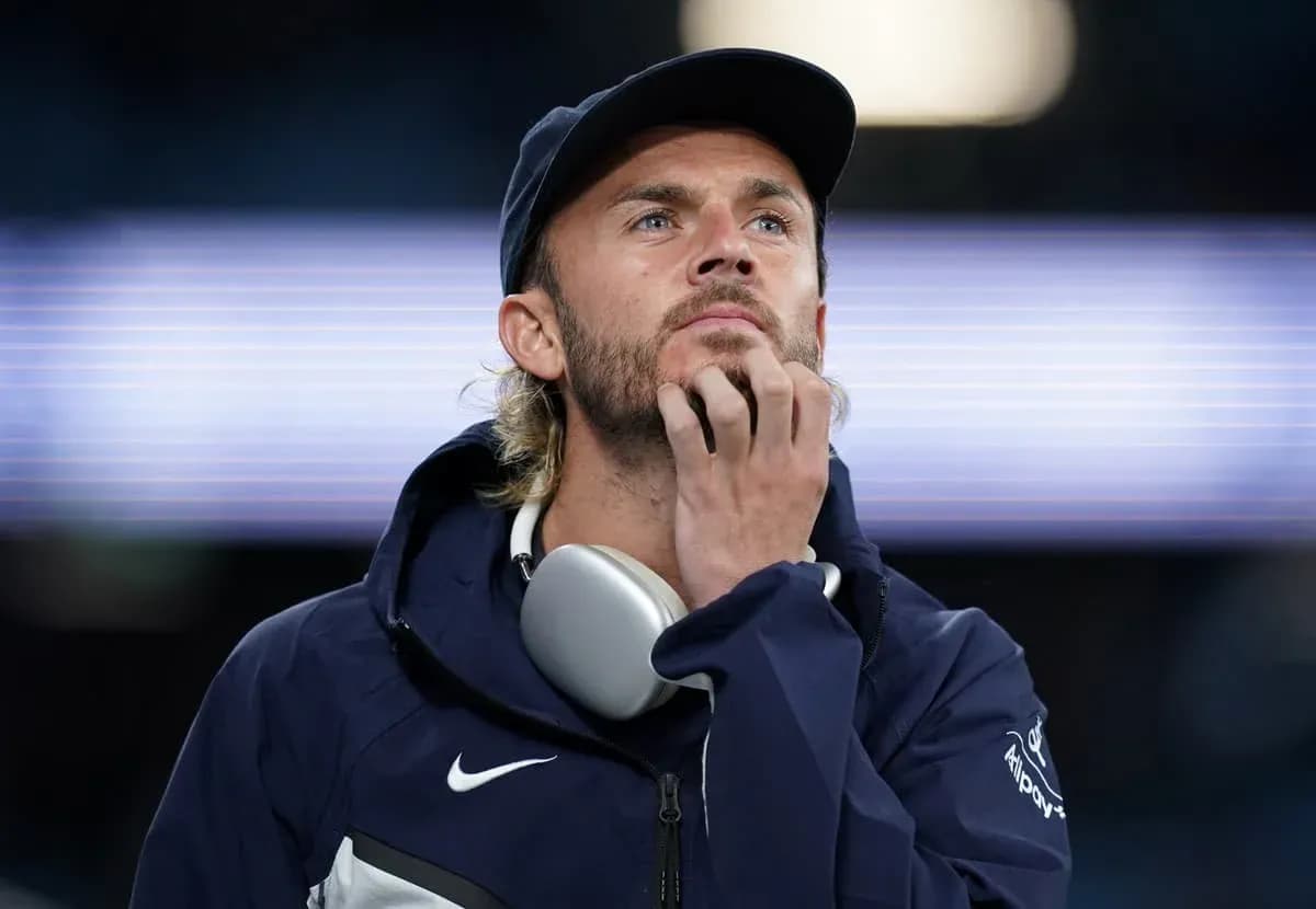 Man in sportswear looking thoughtfully during event