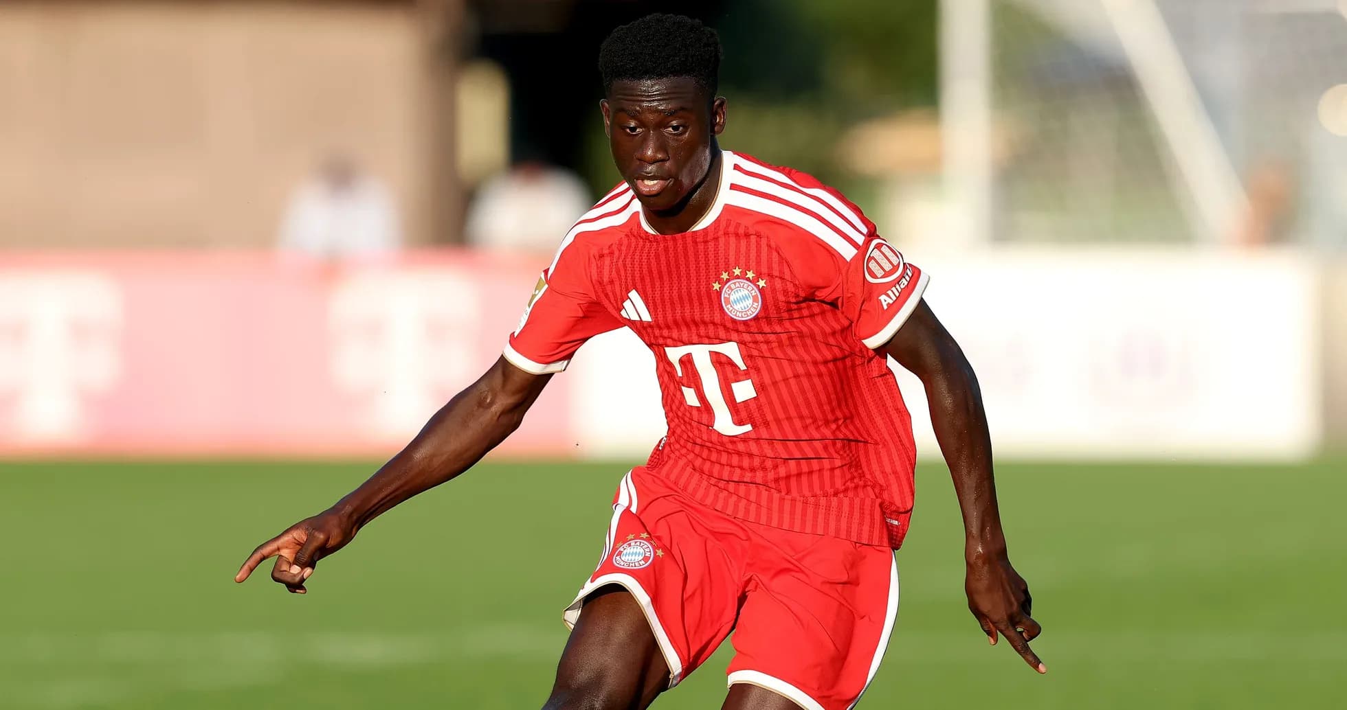 Player in red Bayern Munich kit during match