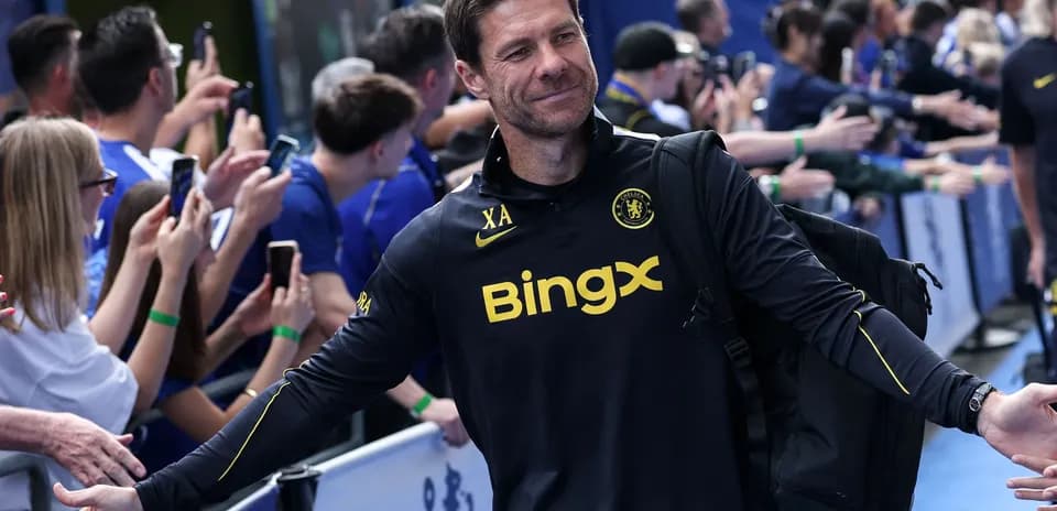 Coach greeting fans outside the stadium