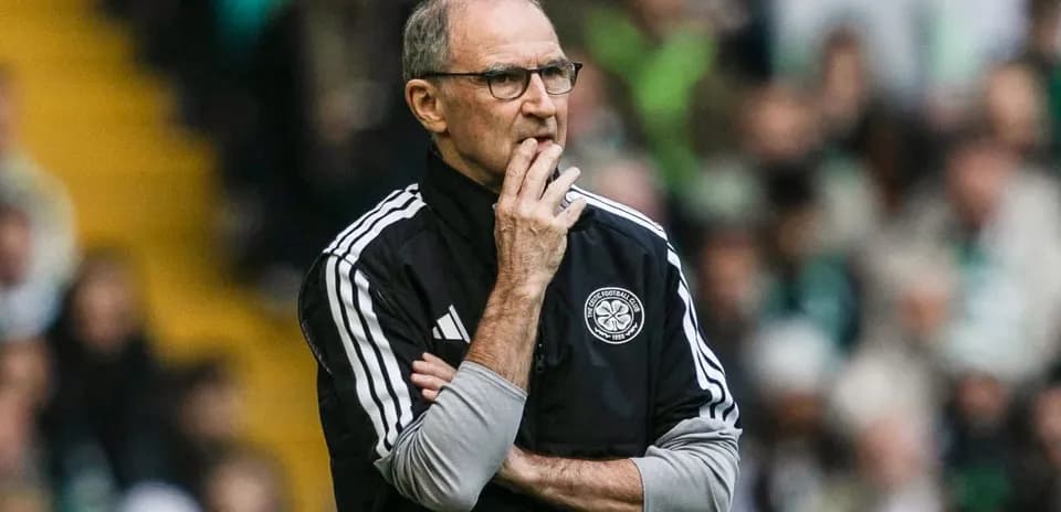Coach observing the match with thoughtful expression