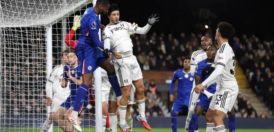 Chelsea player attempting a header during match