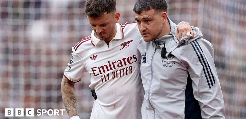 Player receiving support from staff after injury
