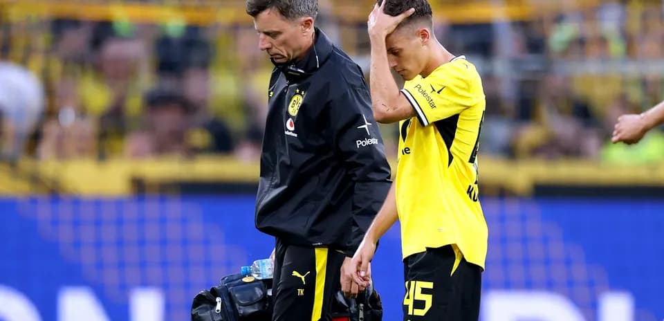 Player receiving medical attention after leaving the field