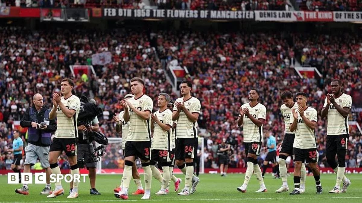 Players applauding fans after match at Old Trafford