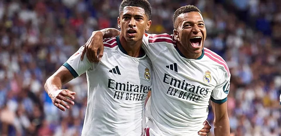Two Real Madrid players celebrating a goal together