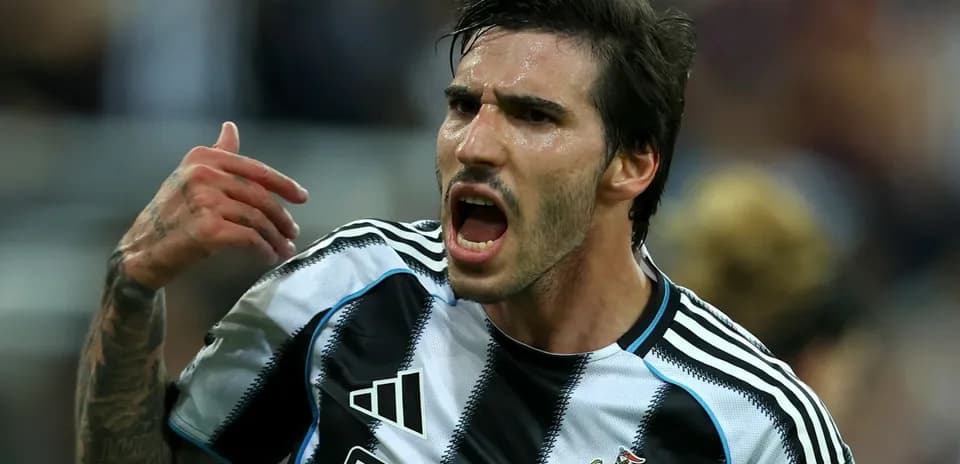 Player celebrating passionately in Newcastle United jersey