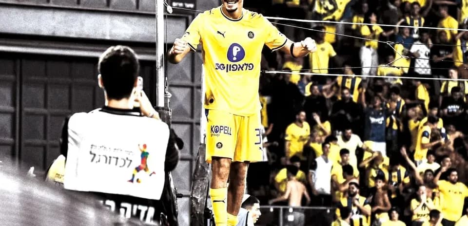 Maccabi Tel Aviv player celebrating with fans