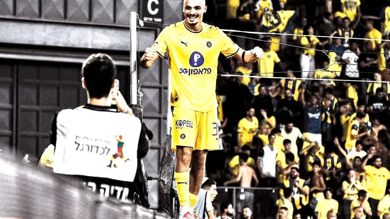 Maccabi Tel Aviv player celebrating with fans