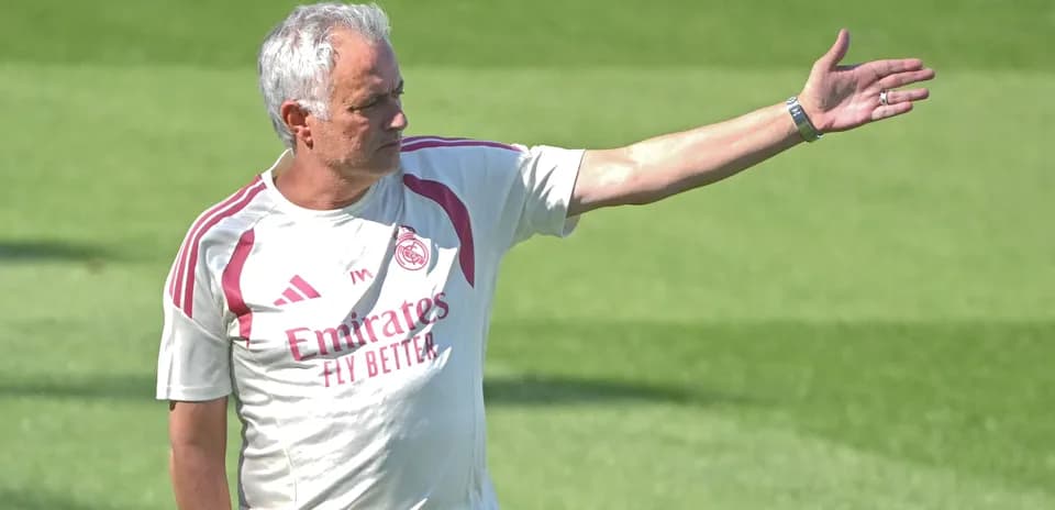 Coach directing players during training session