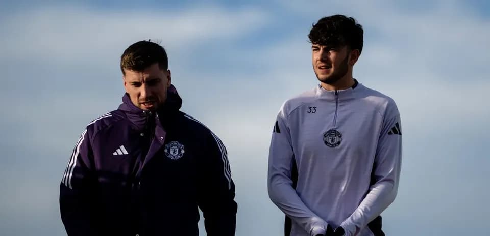 Two Manchester United players walking during training session