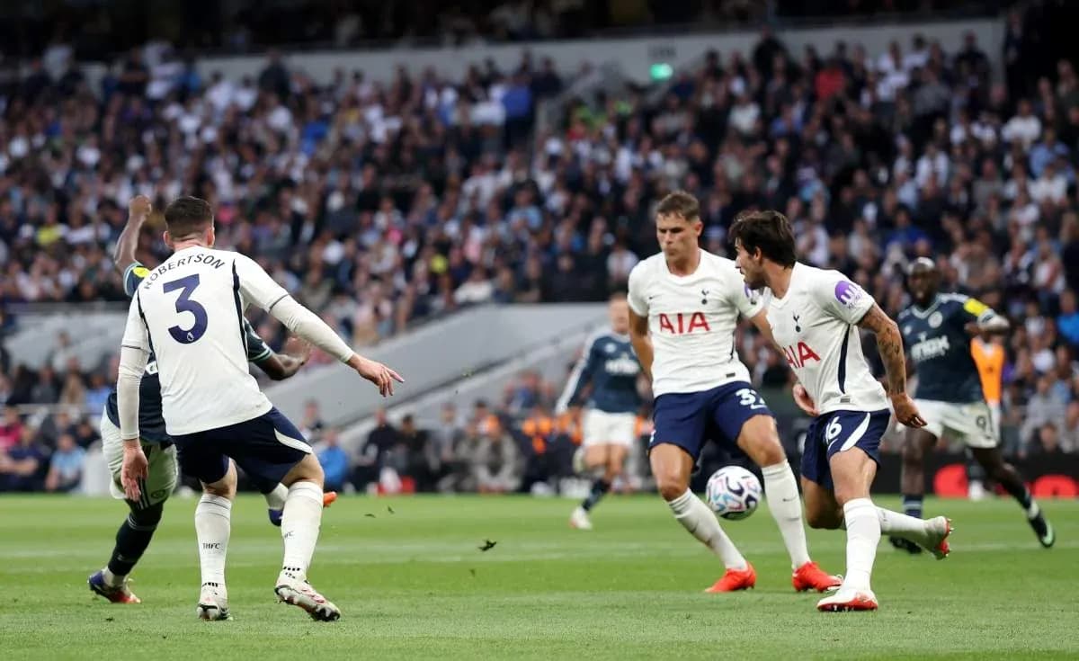 Tottenham players defending against opposing team in match