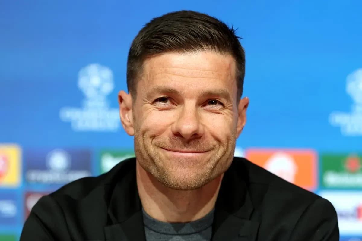 Coach smiling at UEFA Champions League press conference