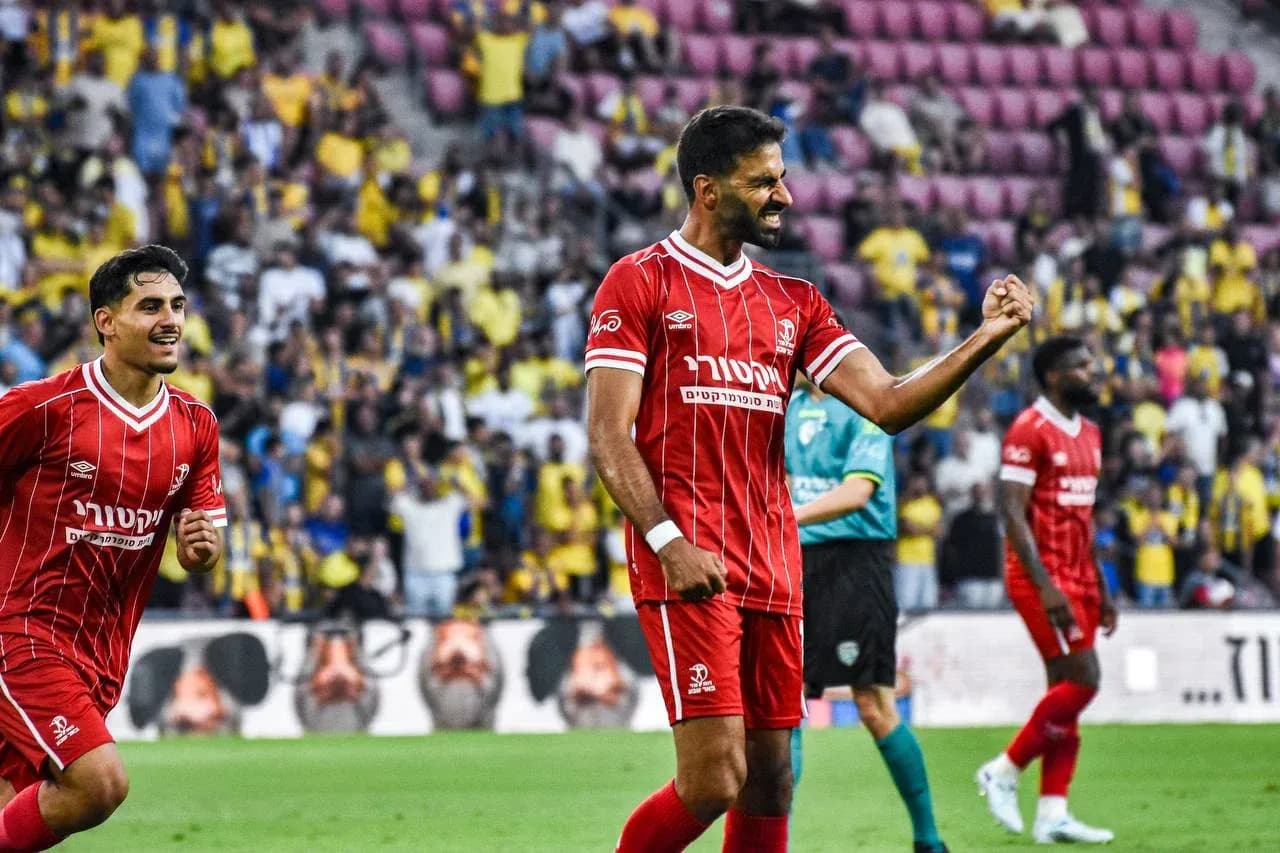 Players celebrating during Hapoel Beer Sheva match