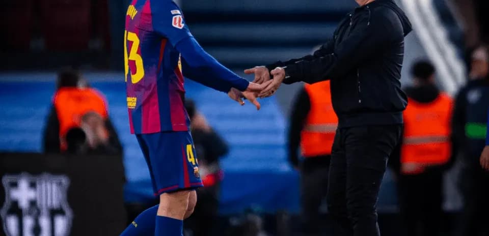 Player and coach shaking hands on the sidelines
