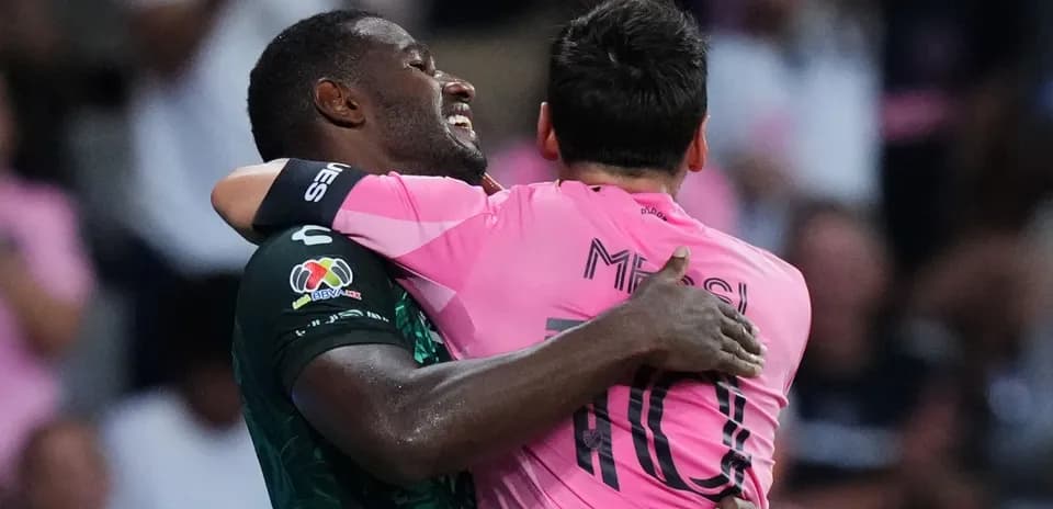 Players celebrating in pink and green jerseys