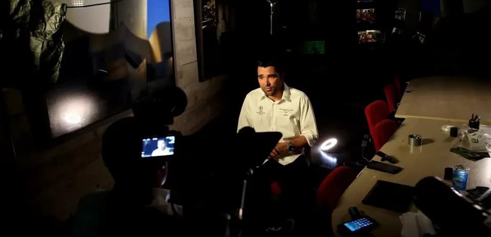 Person being interviewed in a studio setting