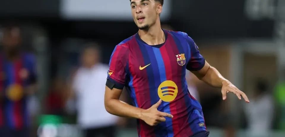 Player celebrating during match wearing Barcelona jersey
