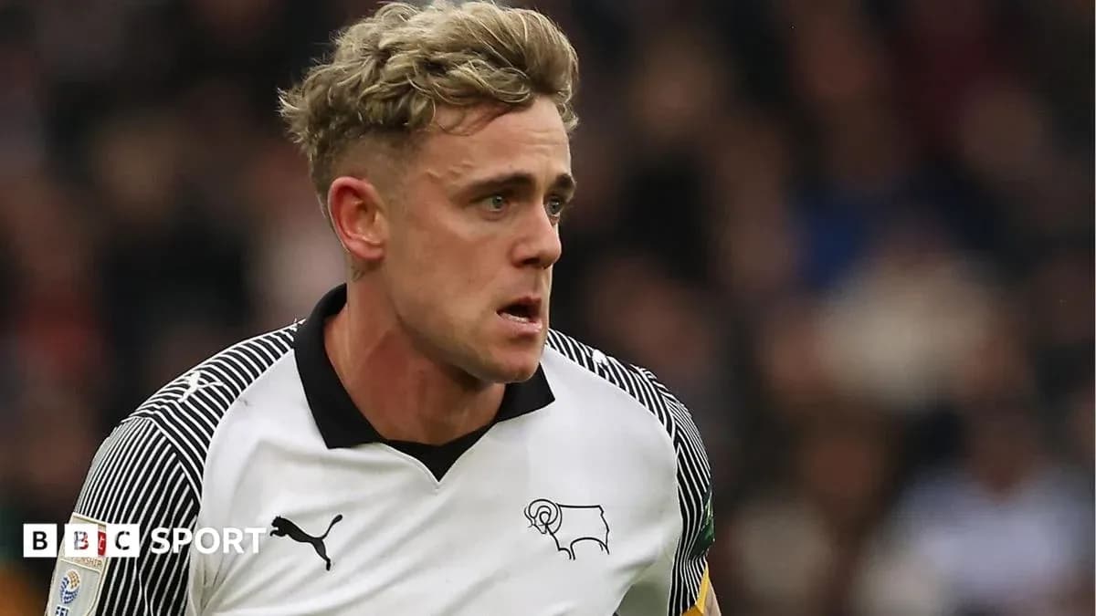Player in Derby County kit during match action