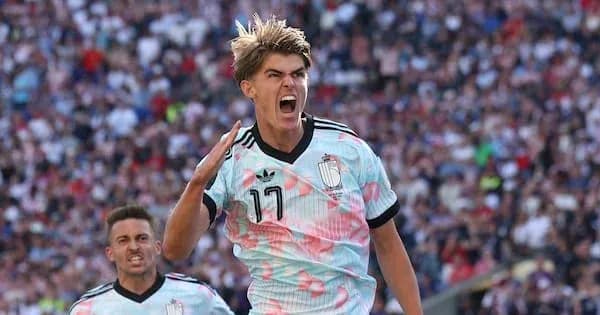 Player celebrating a goal in colorful jersey