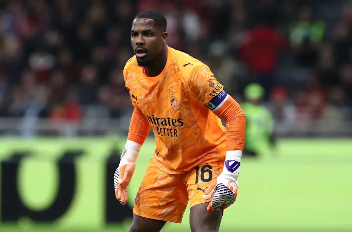 Goalkeeper in orange kit preparing for action