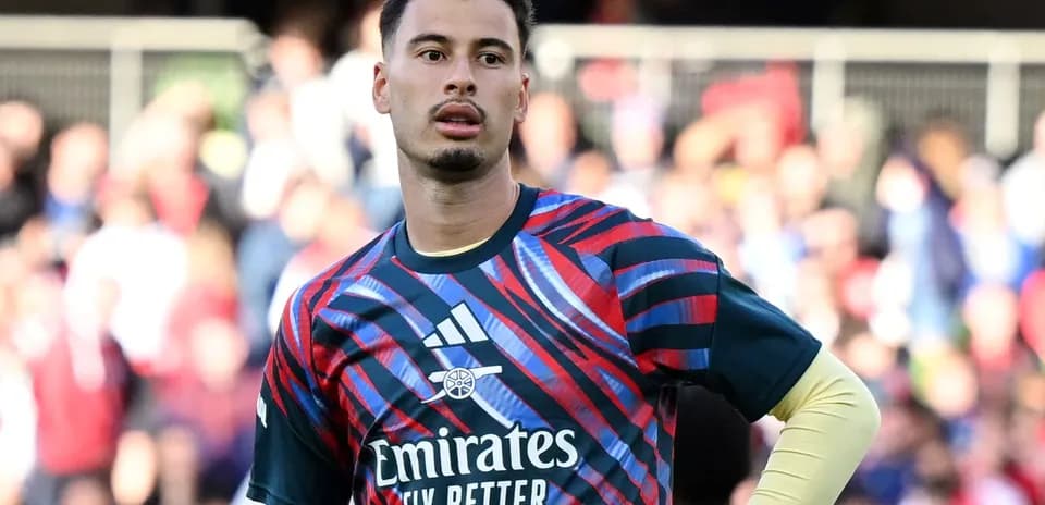 Goalkeeper in colorful training kit on the pitch