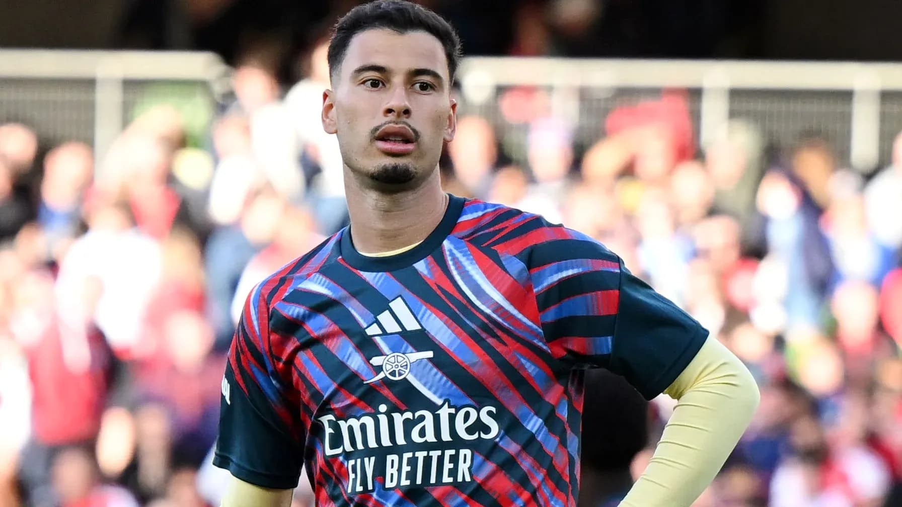 Goalkeeper in colorful training kit on the pitch