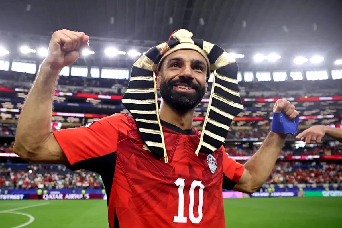 Player celebrating in Pharaoh headdress after match