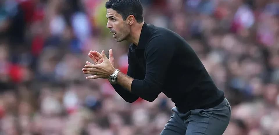 Manager gesturing on the sidelines during match