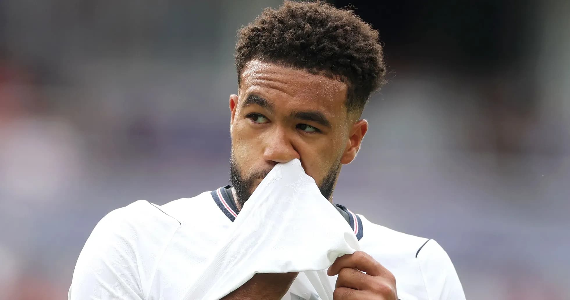 Player wiping his nose with jersey during match
