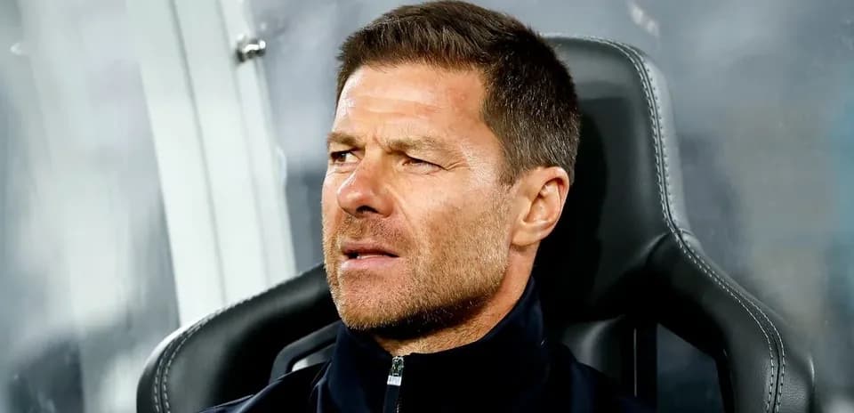 Coach sitting on the bench during a match