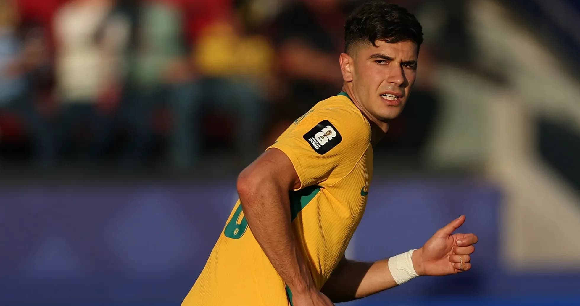 Player in yellow jersey running on the field