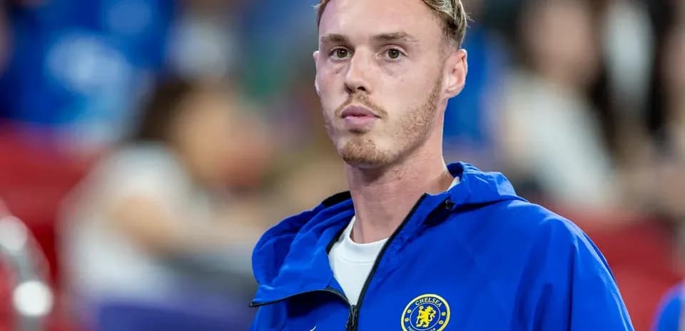 Player in Chelsea jacket during a match