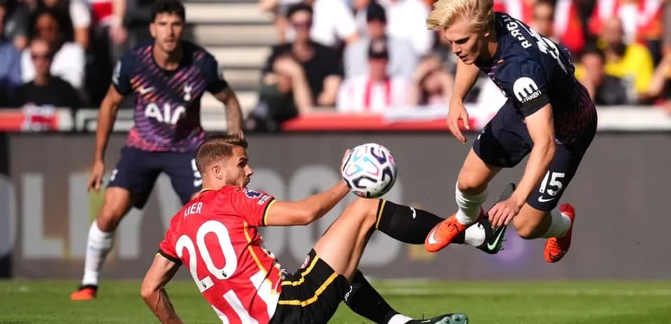 Player tackling opponent during a football match