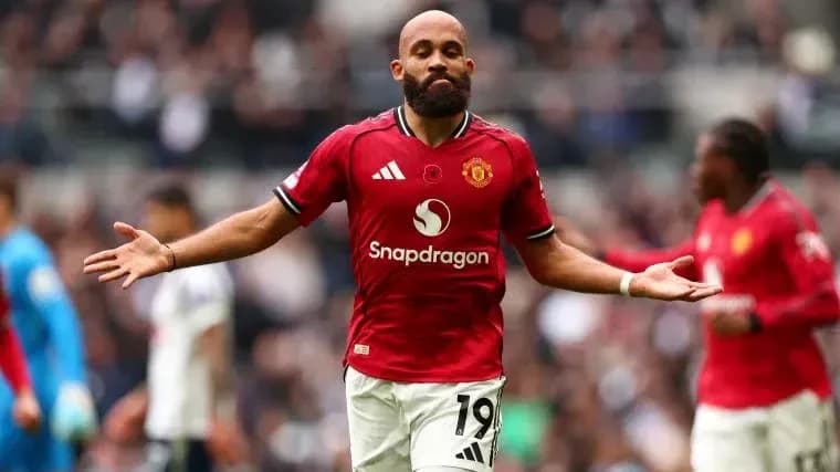 Player in Manchester United kit gestures during match