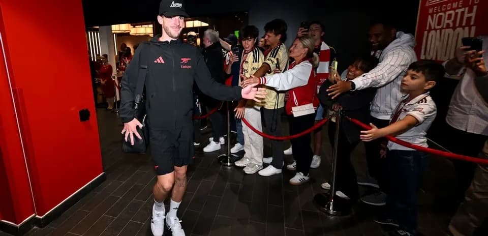 Player greeting fans upon arrival at venue