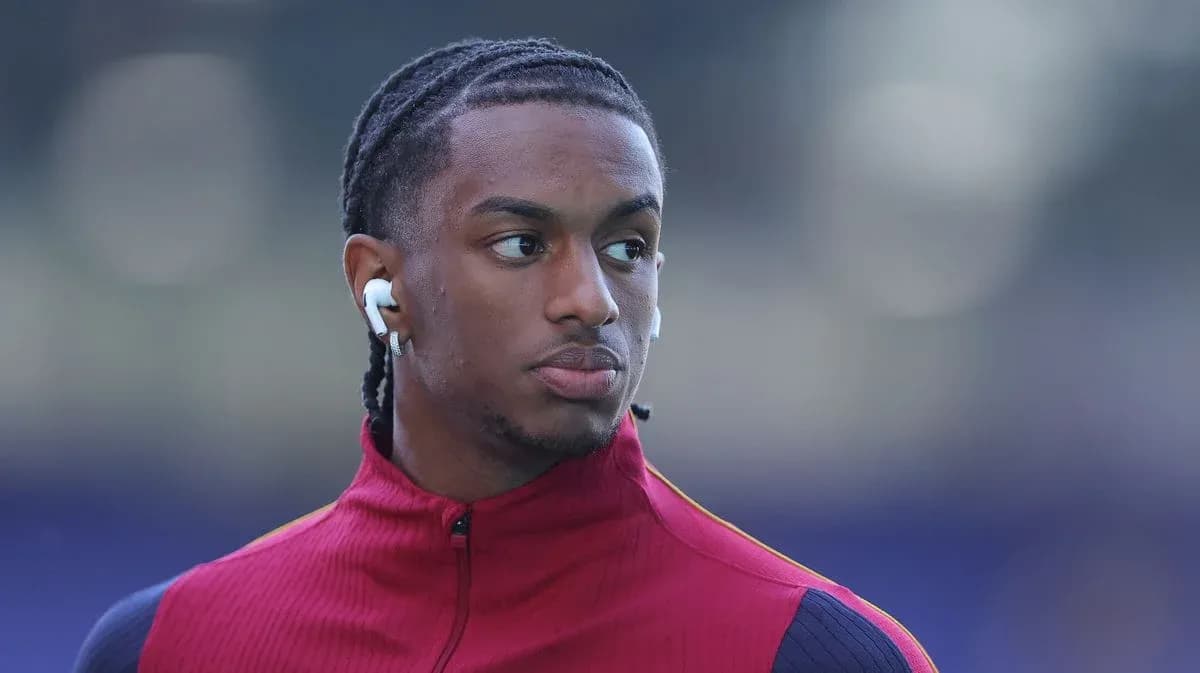 Player wearing earbuds during pre-match warm-up