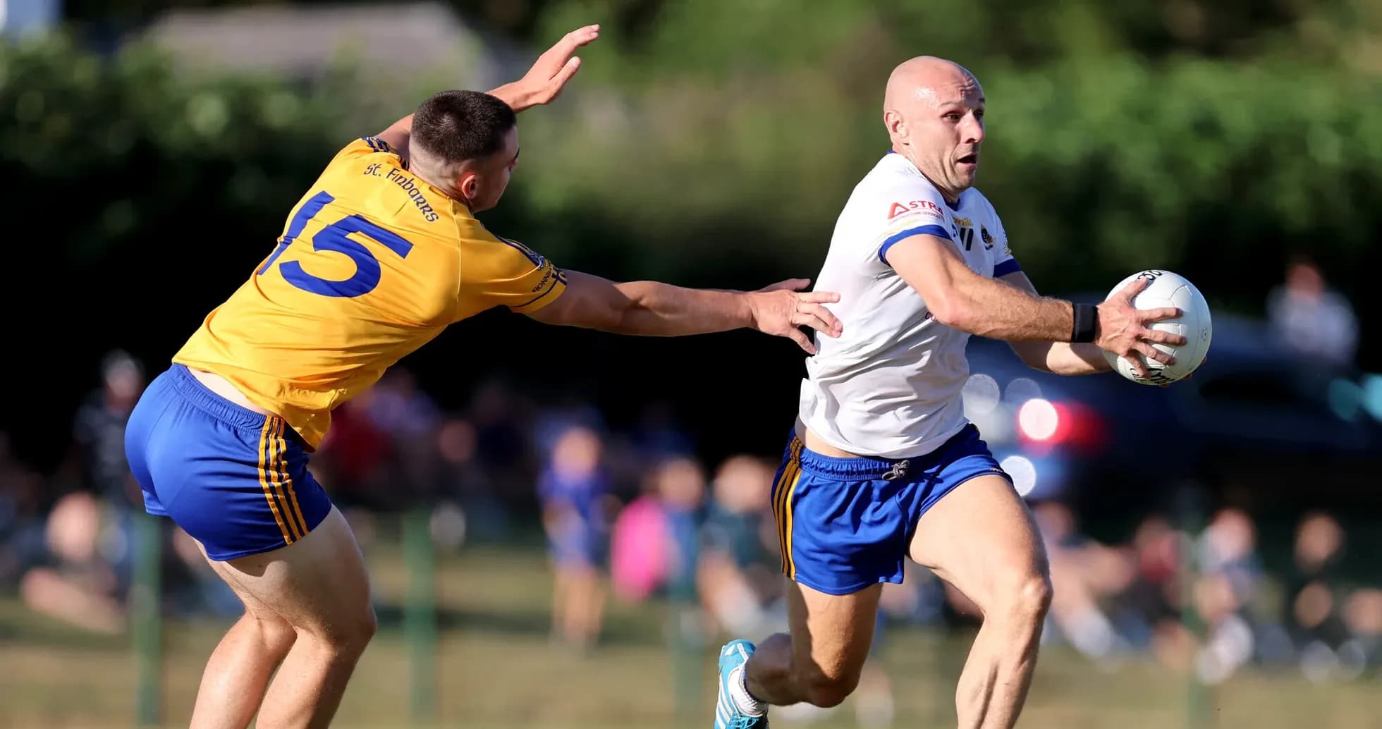 Player running with ball while being chased