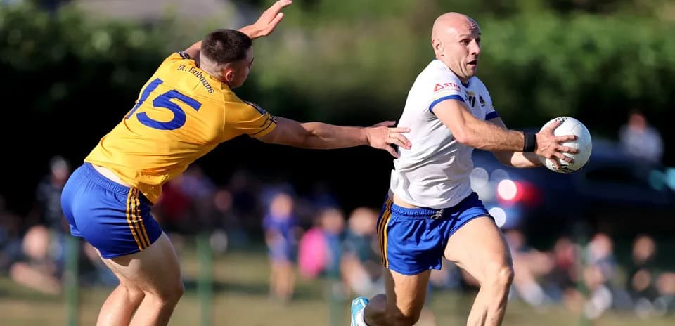 Player running with ball while being chased