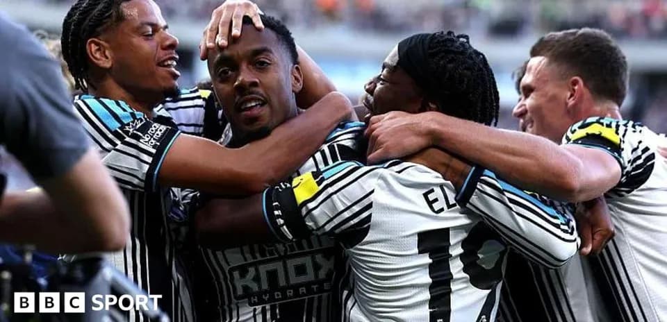 Newcastle players celebrating a goal together