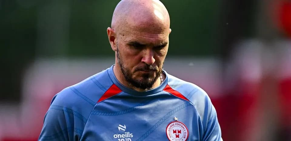 Player in training gear walking off the pitch