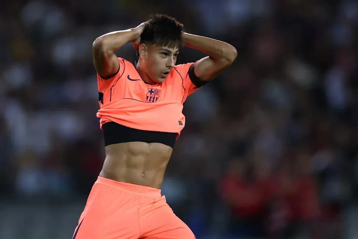Player removing shirt during match celebration