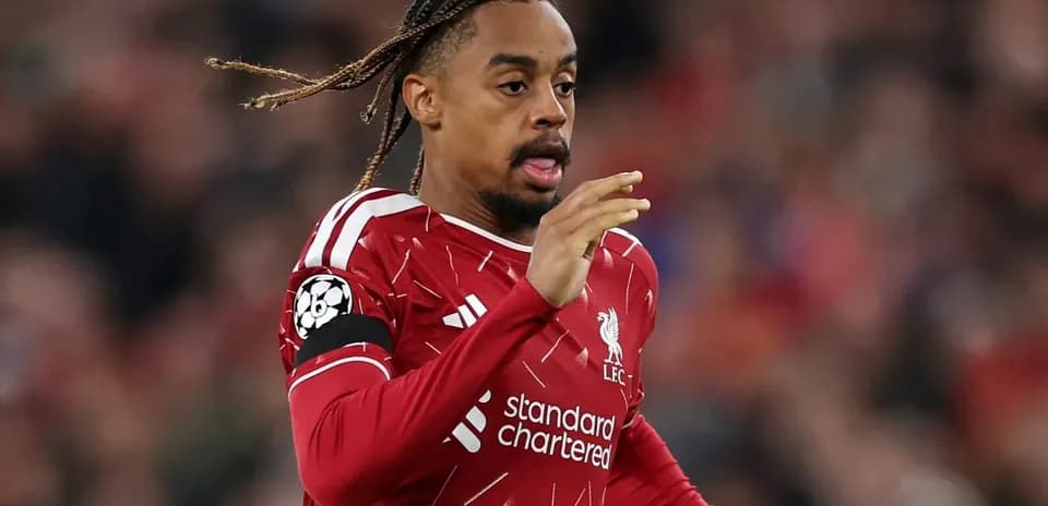 Player in Liverpool kit running on the pitch