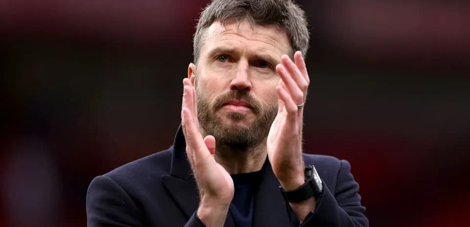 Coach applauding fans after a match