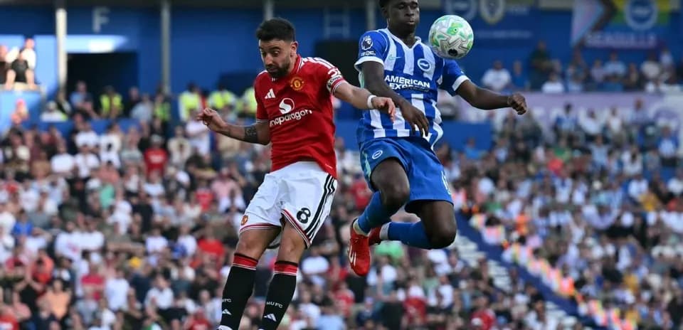 Player from Manchester United heads the ball against Brighton
