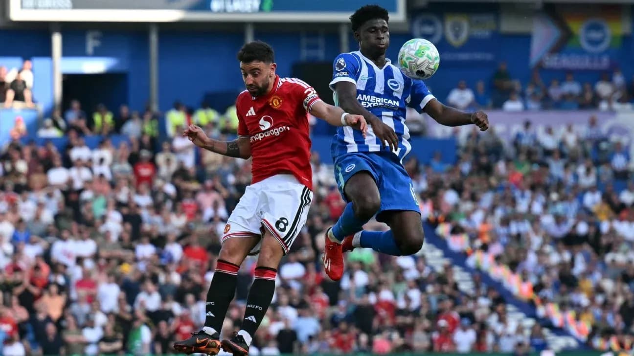 Player from Manchester United heads the ball against Brighton