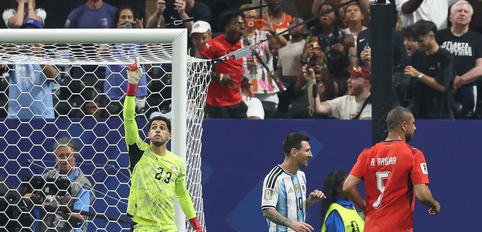 Goalkeeper celebrating with teammates after a save